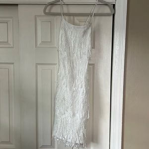 Lulu’s “Making Magic White Fringe Lace-Up Mini Dress”